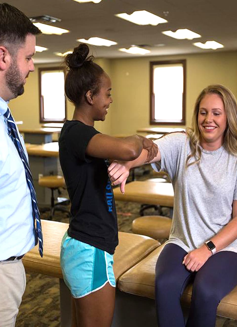 student checking person's arm