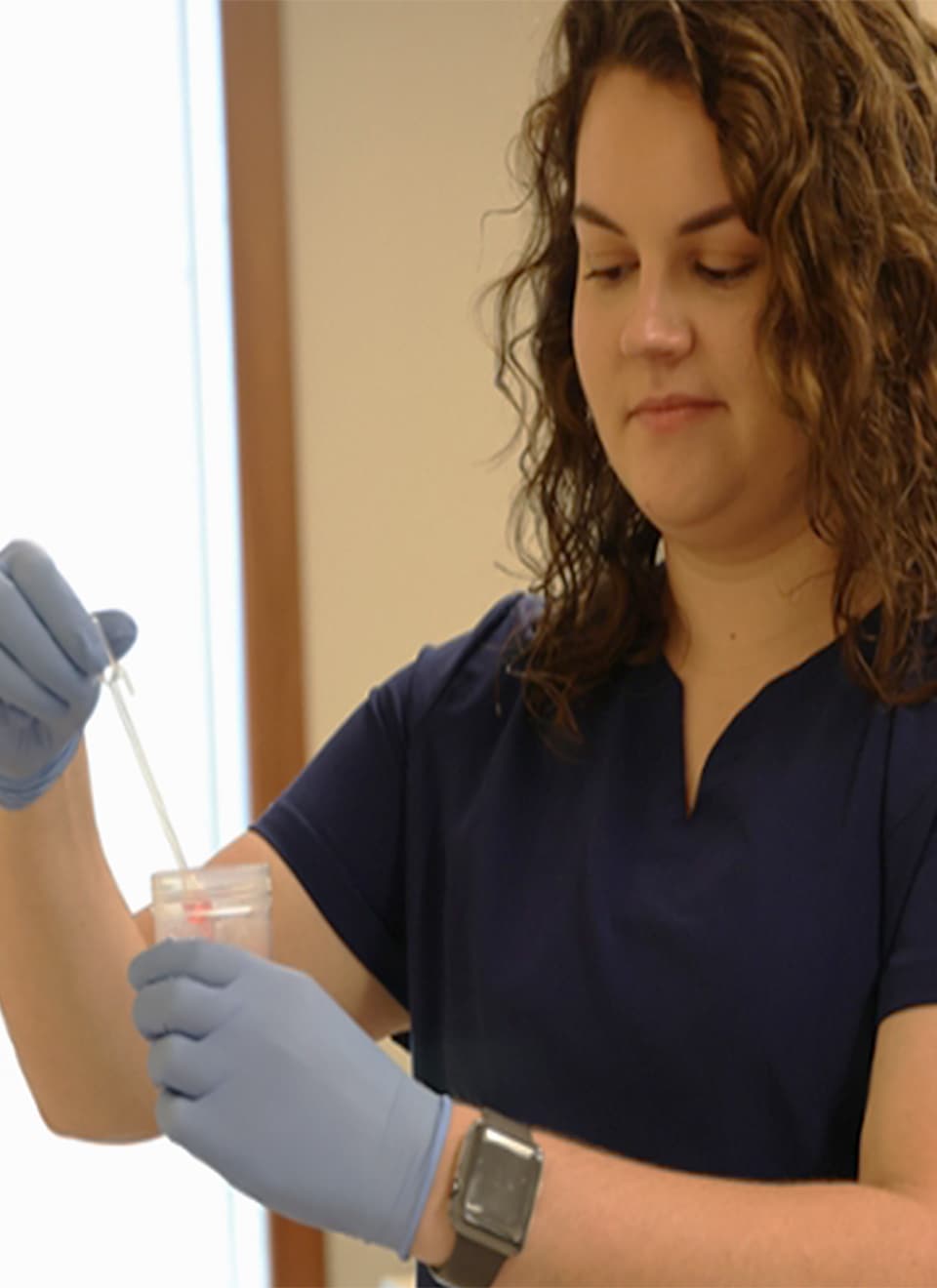student testing chemicals