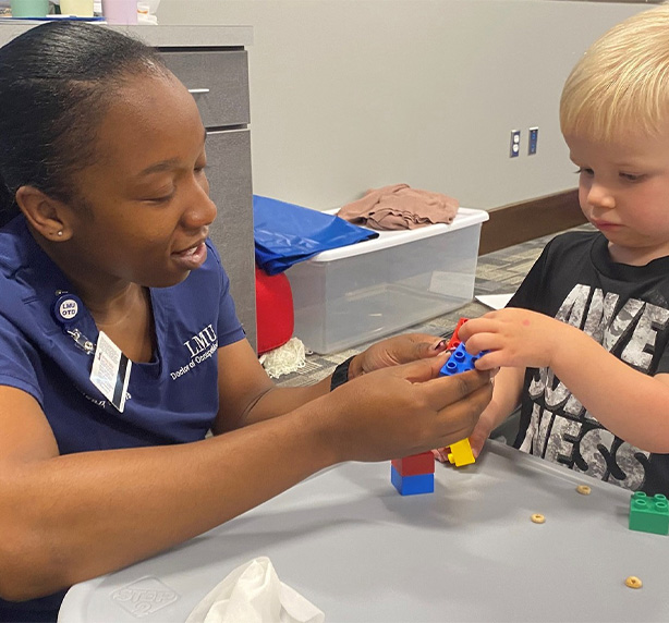 Therapist Helping Child