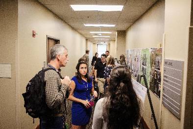 Students discussing research posters