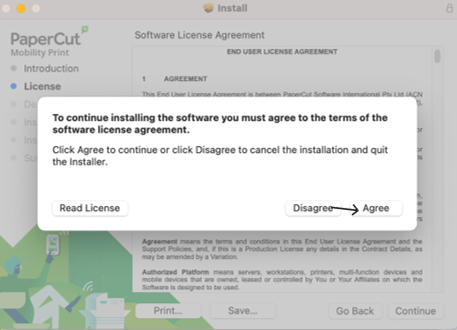 PaperCut Mobility Print terms of software license agreement popup with an arrow pointing to the Agree button
