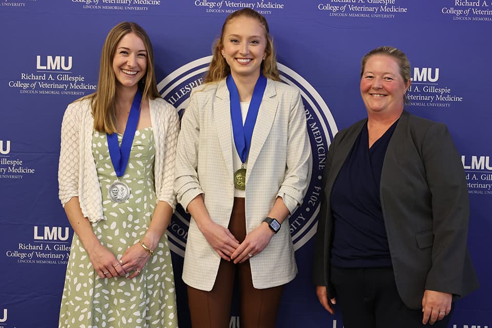 Anderson posing with honor students