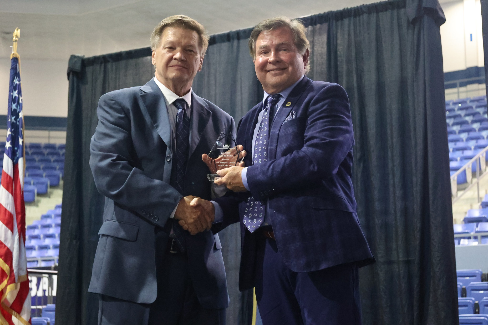 Marty Cosby receiving award from Dr. Hess