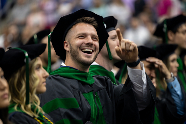 LMU-DCOM graduate smiling