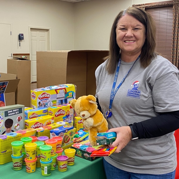 volunteer holding toy