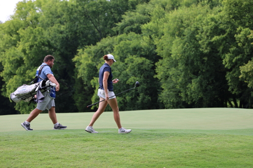 Joy Aspetaki playing in the Smoky Mountain Championship alongside caddie and coach Brad Robinson