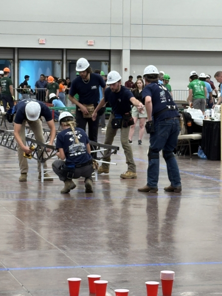 Engineering Students working with their steel bridge