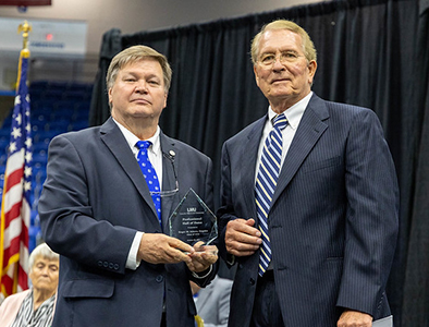 Dr. Hess Inducts Roger Adams