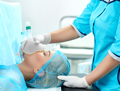 Surgical patient being given anesthesia.