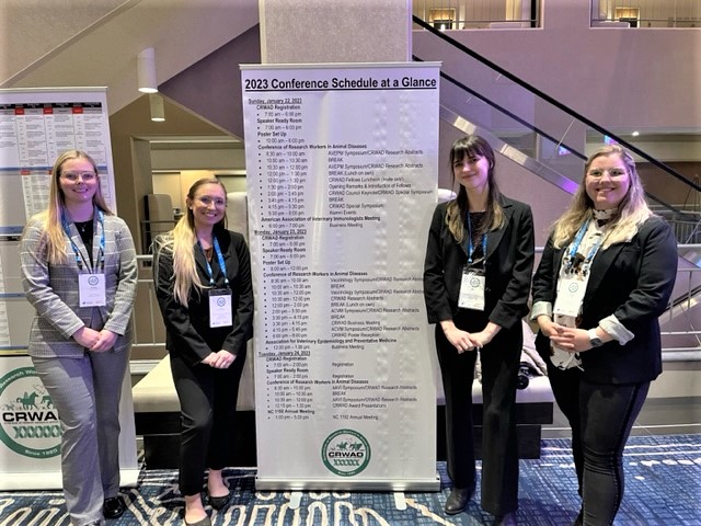 students posing with at conference