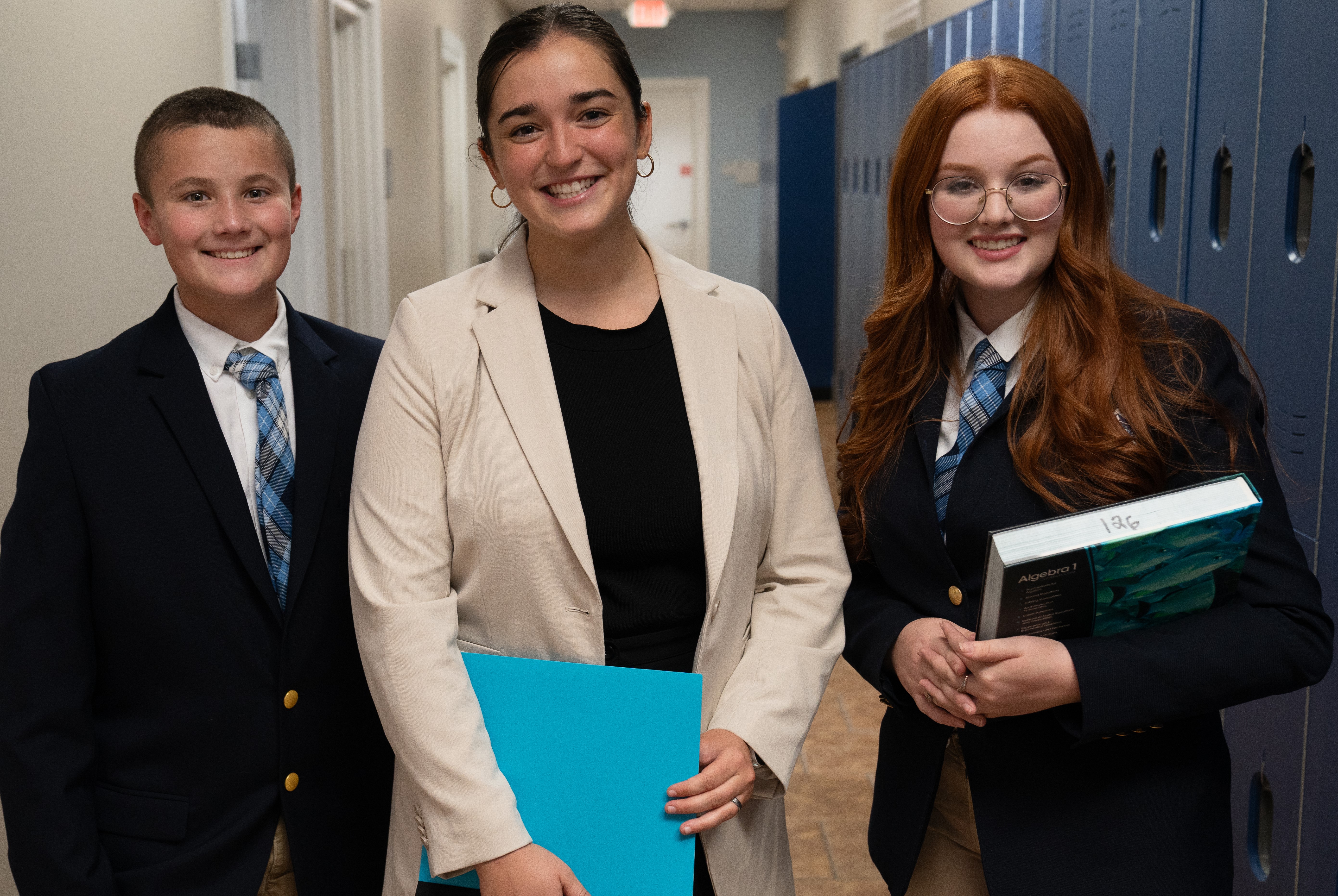 students posed in front of upper school