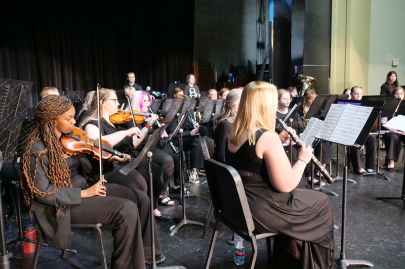 A group of people playing instruments.