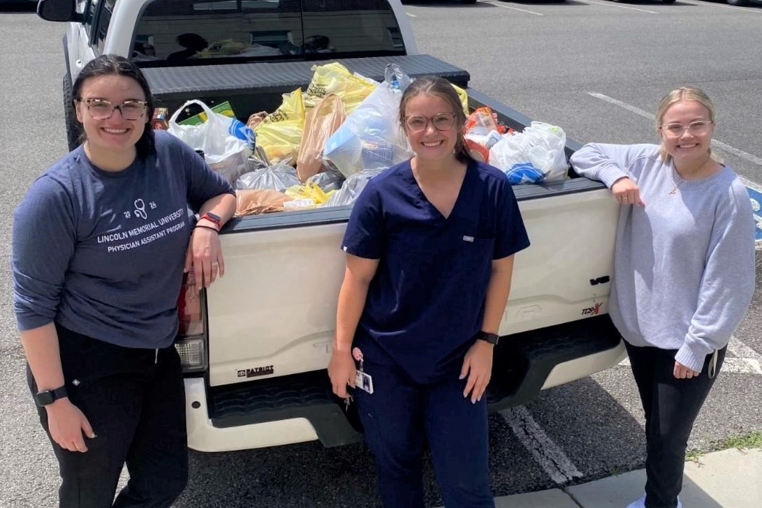 PA students posing with donation