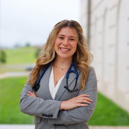 headshot of Kirsten Langa with arms crossed