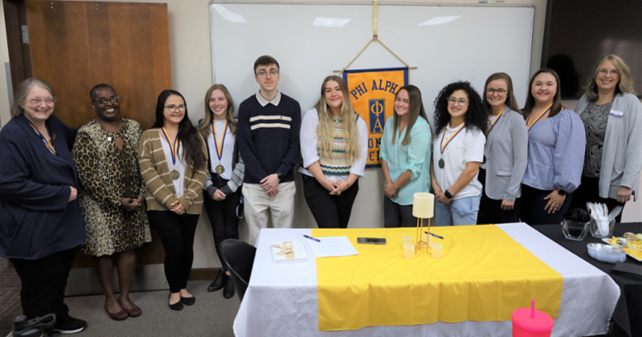 LMU faculty and students lined up after the Phi Alpha Honor Society induction.