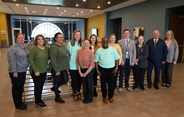 Group of people lined up in recognition of National Social Work Month