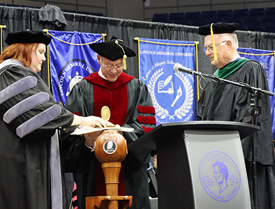 Dr. Mark Tew presents Award to Dr. Joe Smiddy