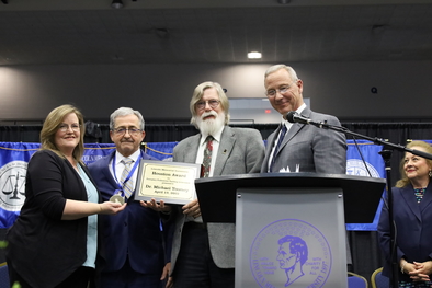 Dr. Tew presents Dr. Toomey with Houston Award