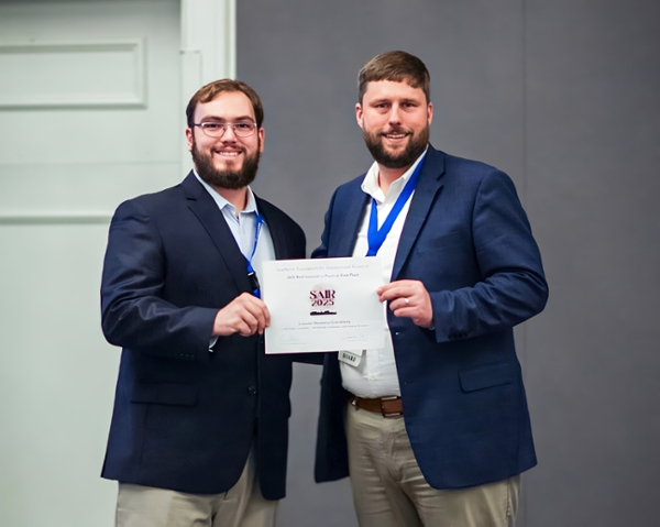 Richie posing with award