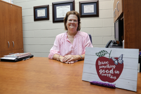Lila Combs at desk
