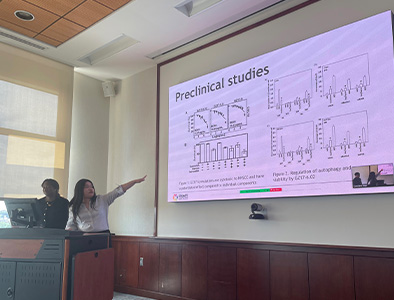 Amy Tran presenting clinical trial data