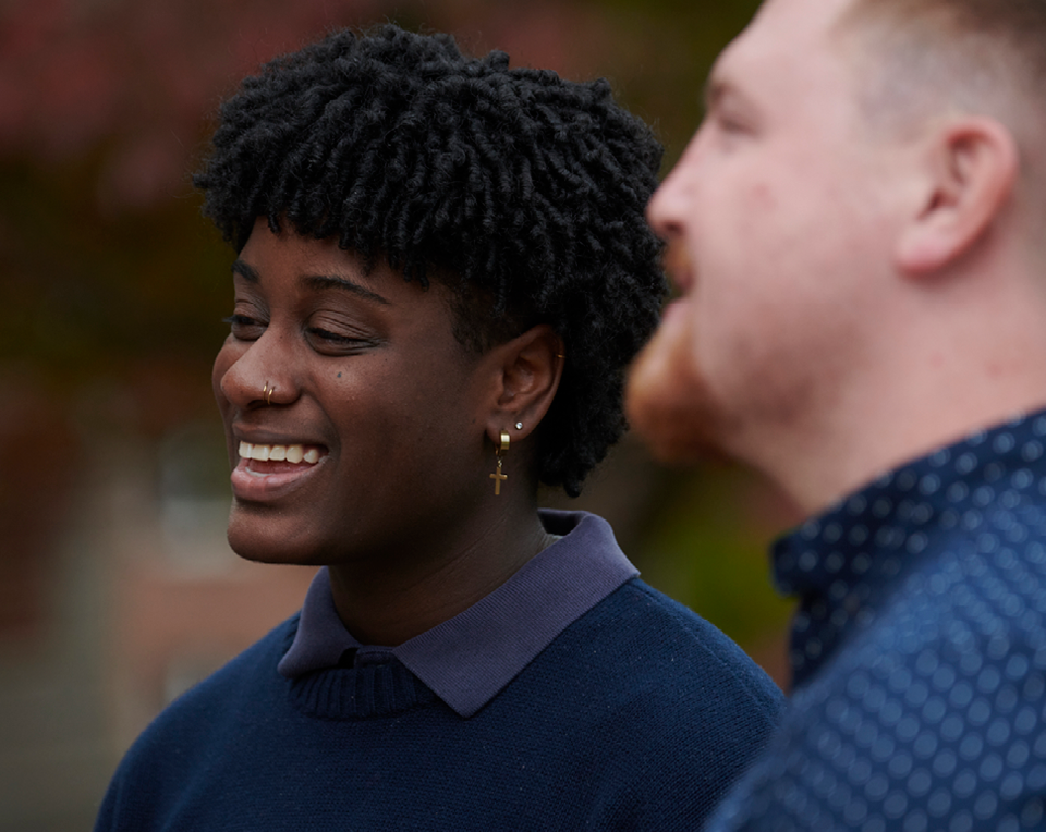 A picture of two people smiling.