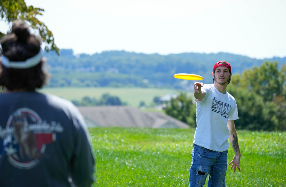 A picture of students playing frisbee.