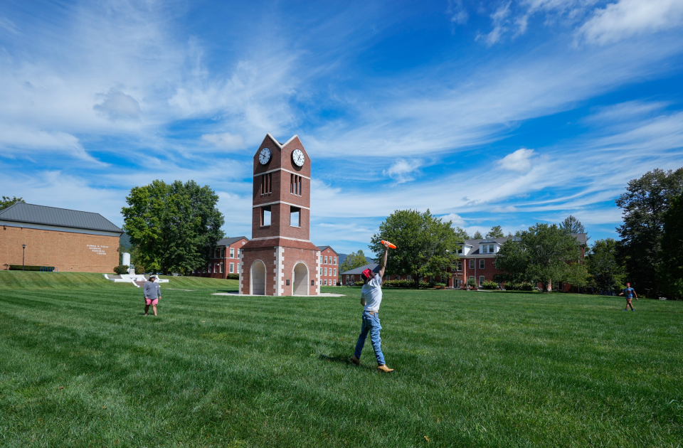 Students playing frisbee on the campus of LMU.