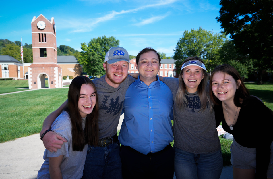 A group of students smiling for a picture.